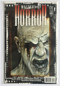 A comic book or graphic novel titled "Masters of Horror" featuring a horror-themed illustrated cover with a screaming face, photographed inside a clear plastic protective sleeve on a white background.