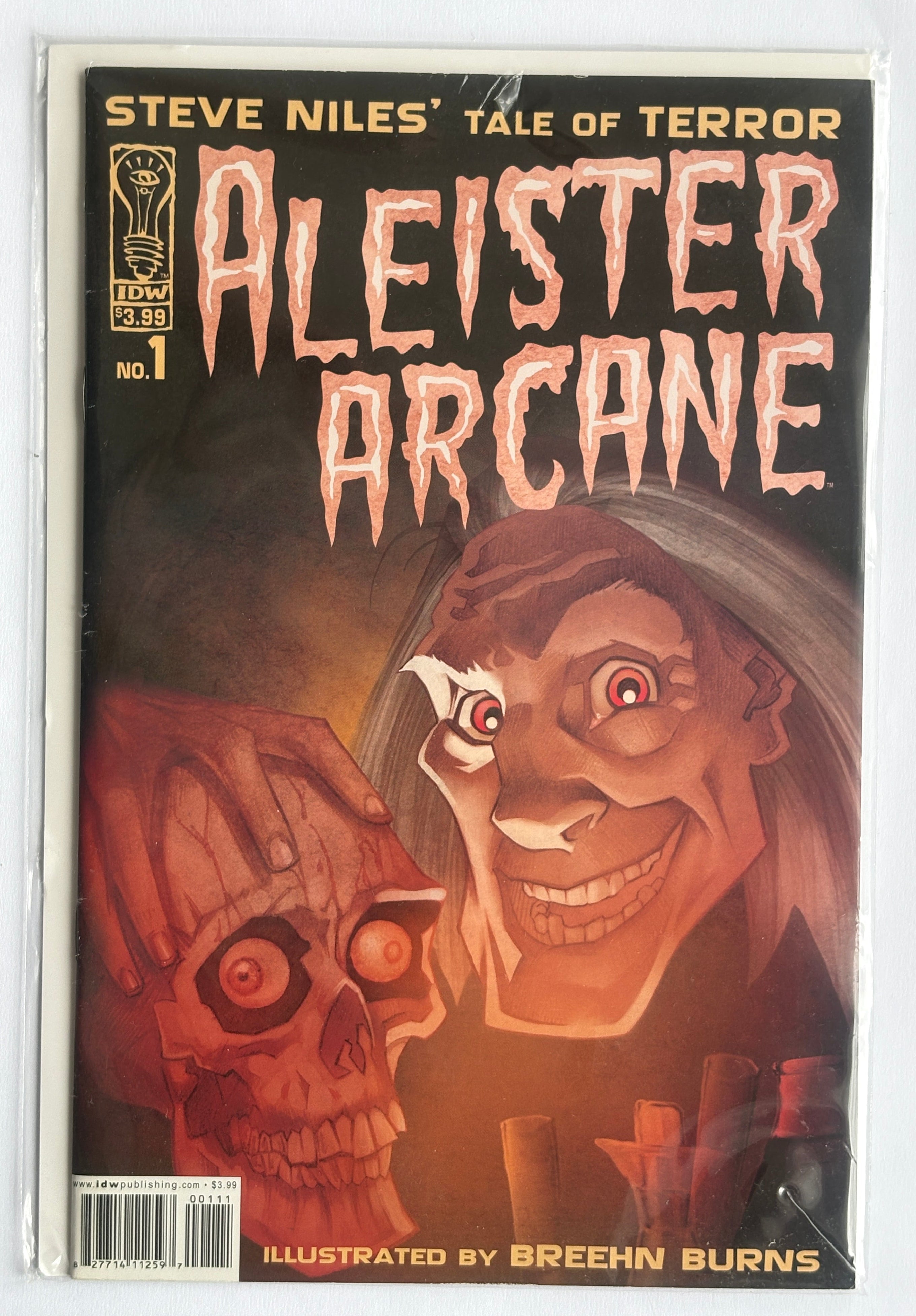 A comic book titled 'Aleister Arcane' issue number 1, featuring illustrated artwork of a creepy smiling face and a skull, photographed flat against a white background.